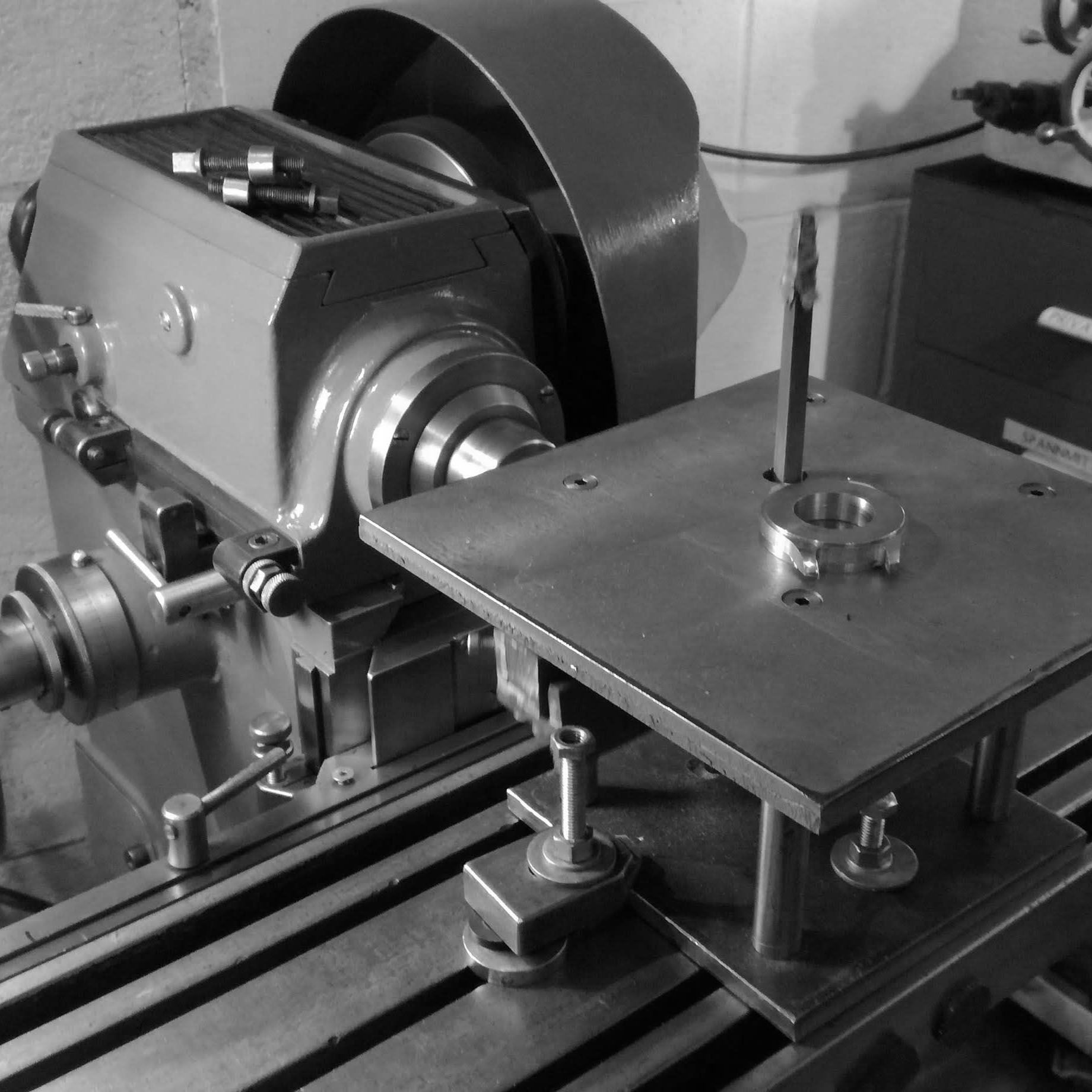 Using a shop-made die-filing machine on the Aciera F3 milling machine to file the interior portion of the lugs.