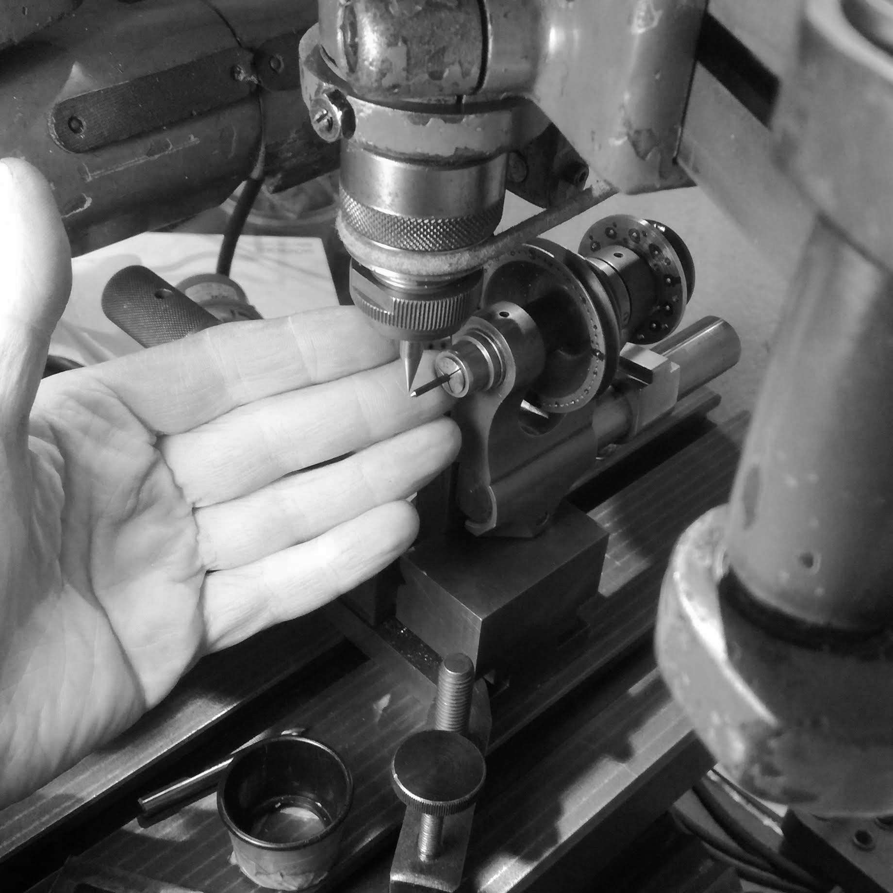 Centering the dividing head with the spindle nose of the pantograph.