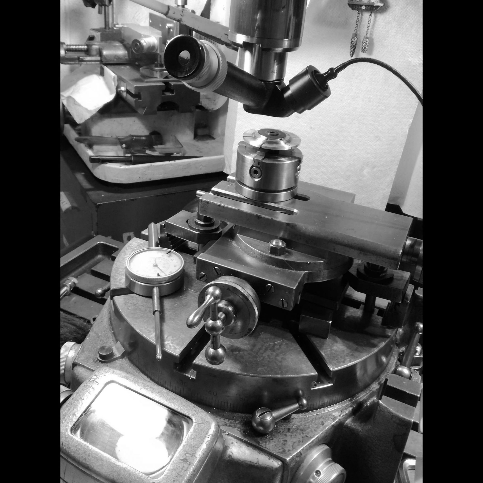 I then move the X a-xis to the center of the dial's 'track' and check the proper concentricty of rotation when the centering microscope.