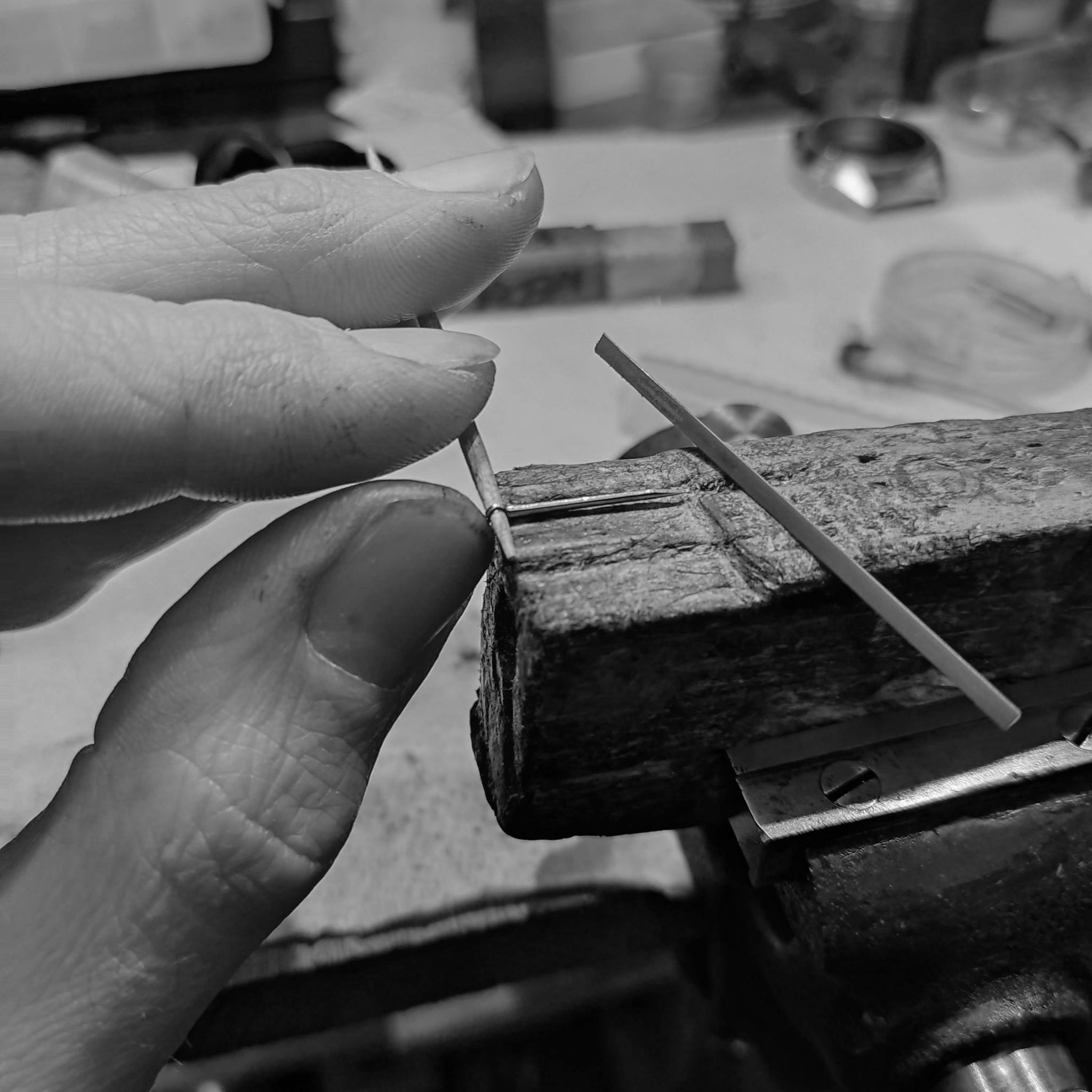 Here I touch up the side of the hand to correct the angle at the hub area with a ruby filing stone.