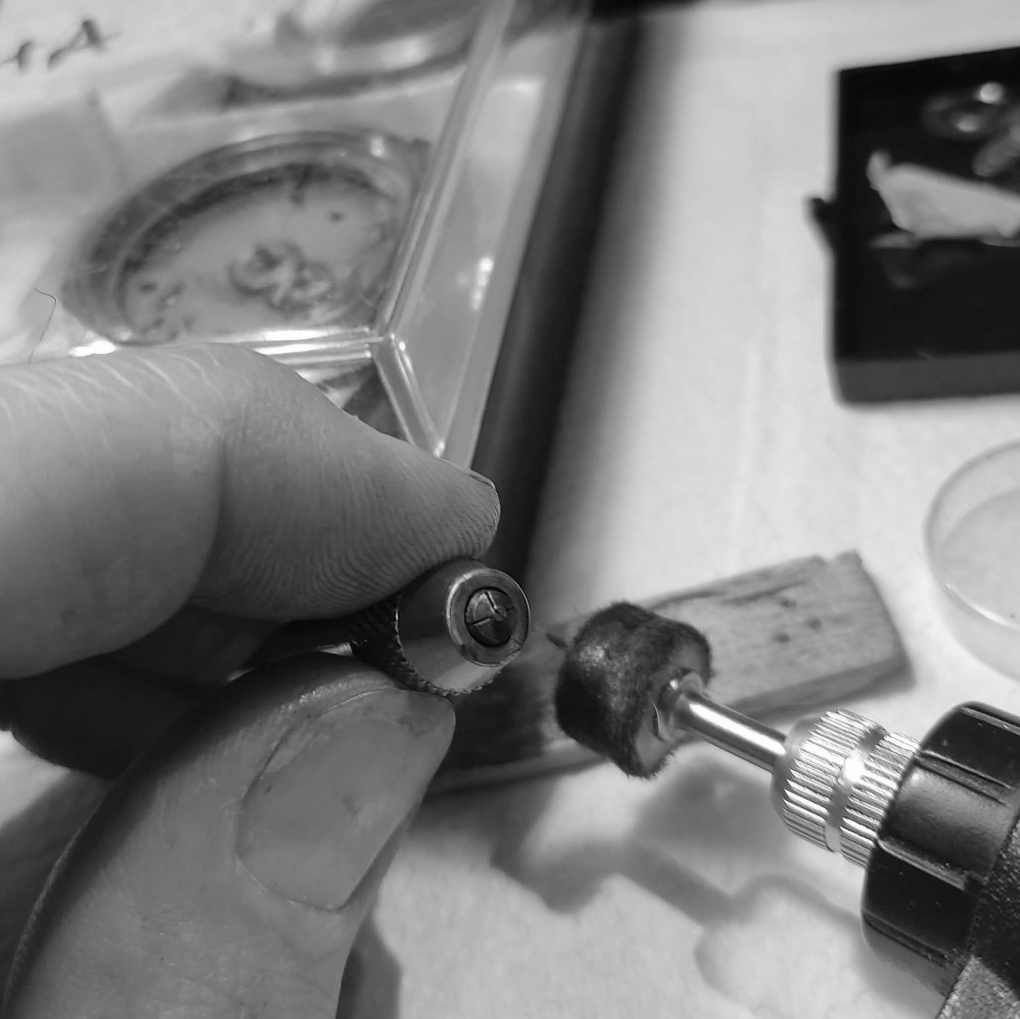 Here I polish a screw head. I will not fix deeply marred screw heads (there are none fortunately), but if it is over polished, it can change the slightly domed nature of the screw heards.