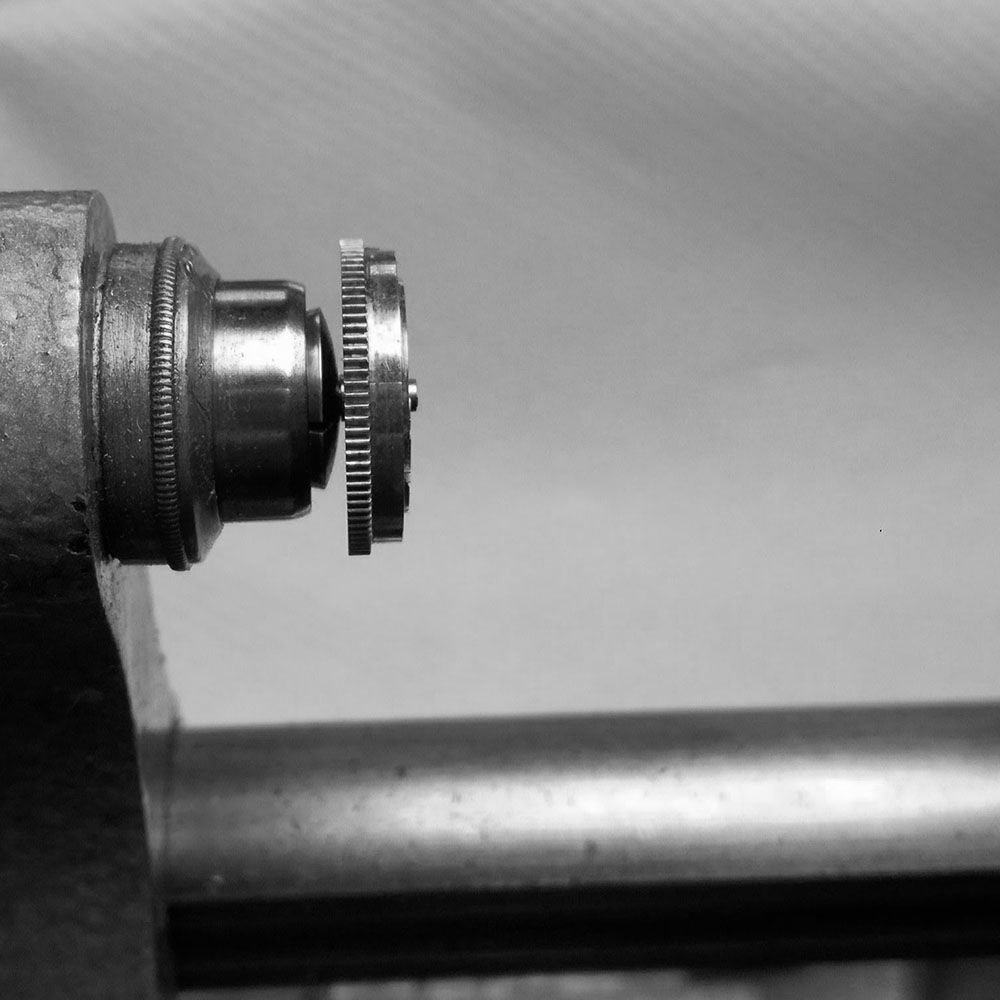 Checking on lathe, the mainspring wobbles and is out of truth.