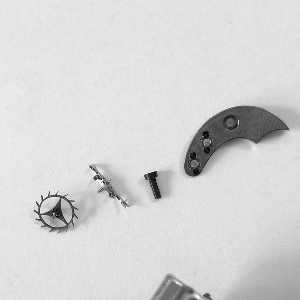The escapement bridge, wheel and lever.