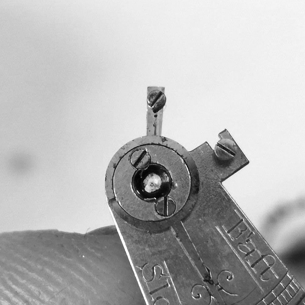 Diamond balance staff end jewel. Both the cap and pivot jewels are in good condition.