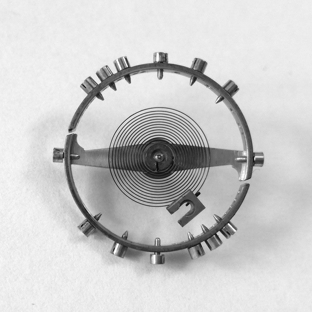 Recording the position of hairspring stud in order to guarantee the same timing when the new staff is fitted.