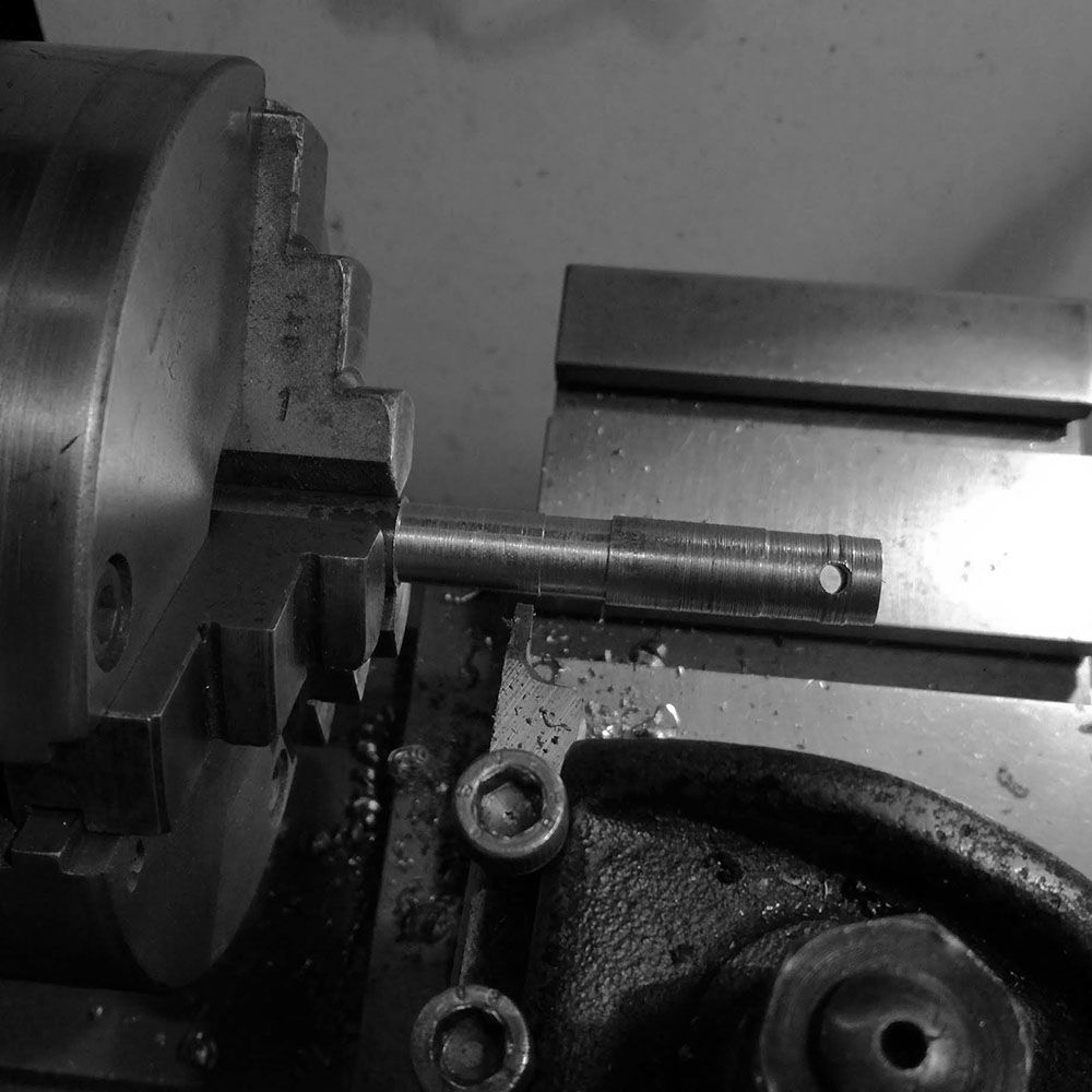 In order to shape the outer perimeter of the hub better, I needed to create a slitting saw holder that will be held in the jig borer. As the current grinding stone's diameter does not permit me to grind the area close to the hand well.