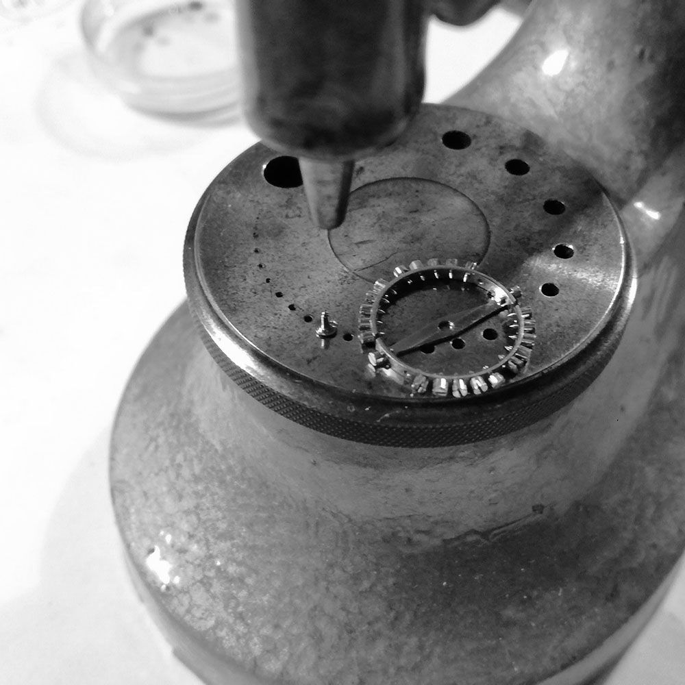 Placing the balance on the staking tool, to rivet the balance on the staff.