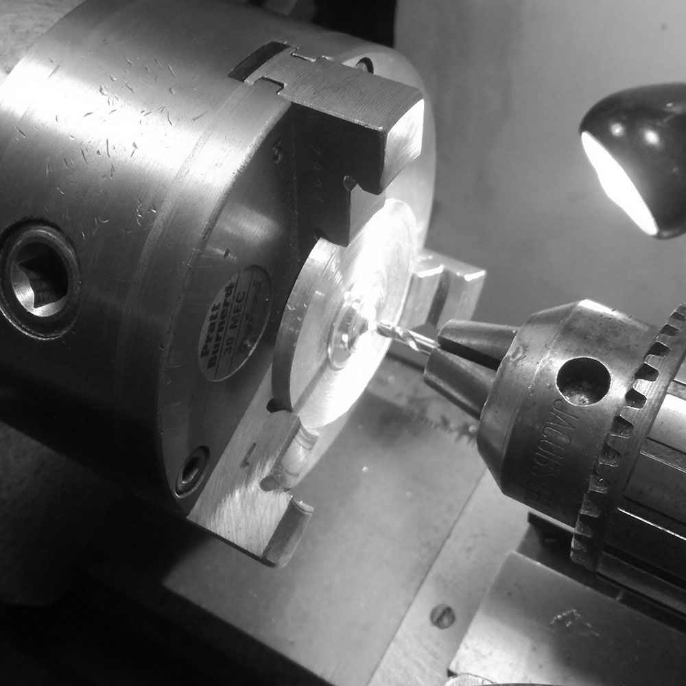 In order to further machine the bezel, I make an aluminum ring to hold the bezel in the chuck, and thus not score it.